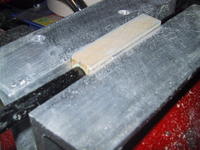 Name: IMG_4280.jpg
Views: 442
Size: 87.7 KB
Description: The infamous joiner blocks. Didn't have a band saw so put these two angles in a vise to create a flat surface for sanding. It is quite a bit of work but the results are great.