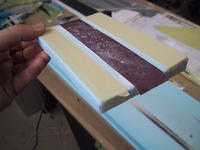 Name: IMG_4327.jpg
Views: 419
Size: 52.9 KB
Description: Here is the bottom of the sanding jig which has an airfoil cut and masking tape to adjust the height. It really works well.