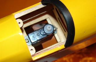 The Blue Arrow servos require a 3/32� hard balsa shim for a proper fit. Pay particular attention to which end of the servo tray the shim is installed on.