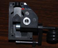 Name: Retracts_003.jpg
Views: 363
Size: 52.8 KB
Description: The pivot block is in the gear extended position with the top flat portion resting against the rounded stop formed into the case. A little clockwise preasure will deform the rounded stop enough to allow the pivot to move past into an over extended positio
