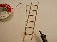 Name: P1010129 copy.jpg
Views: 83
Size: 27.8 KB
Description: Remove your tape, and the ladder is free.
The Flux has stained the paper, but the paper is not burnt. No need for long heating periods to do this.