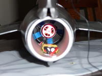 Name: P1000795.jpg
Views: 202
Size: 46.5 KB
Description: ESC in thrust tube. I have since rotated it to the 8 o'clock position after I had a flame-out which I suspect was caused by water from a heavy dew pooling around the ESC (luckily no damage and ESC tested fine when dried out).