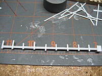 Name: 007.jpg
Views: 53
Size: 116.9 KB
Description: Once the glue has firmly set, I will trim these and sand them flush.  Then we will see how it looks on the mast leg.  Stay tuned!