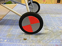 Name: 2012_0428170002.jpg
Views: 48
Size: 221.5 KB
Description: They are hiding behind Bristol Strathmore painted cutouts.  Simple but effective.  Used my handy dandy circle cutter for the first time today.  What a great invention.  Painted the covers then glued them on.  To permanently mount the wheels, I made some w