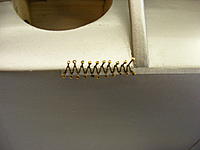 Name: 2012_0428170005.jpg
Views: 58
Size: 182.5 KB
Description: Pins stuck in the fuse and thread laced around them.  Coated the thread with Lacquer then let dry.
