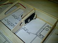 Name: IMG-20120310-00040.jpg
Views: 18
Size: 236.6 KB
Description: Use ST and STS ply parts from kit.  I chose to place servo inward one rib, so will have to move flap control horn ply mount inward to align with control rod.  This mod may be easier to do after wings are attached with dihedral brace.