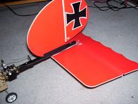 Name: 013.jpg
Views: 287
Size: 69.2 KB
Description: Stock SS tail, except I mounted the vert on top of the boom, sandwiched between balsa strips, ca'ed on.