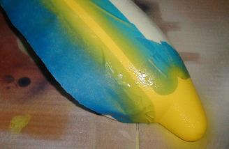 Applying the yellow paint.