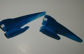 Small plastic pieces hold the cowl retaining screws.