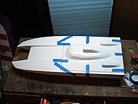 Name: AV0004.jpg
Views: 35
Size: 270.7 KB
Description: After initial inspection I taped the hatch back down and left the hull on a nice flat surface just in case it might still be a little bit green. Some of the caulking around the sponson tips still felt a little bit tacky when it 1st came out of the box.