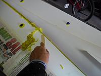 Name: SAM_1906s.jpg
Views: 70
Size: 84.3 KB
Description: Using a wooden mixing stick thge putty is scraped off flush with the board.