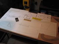 Name: IMG_4320.jpg
Views: 180
Size: 56.5 KB
Description: The tail booms and vertical stabilizer came next.  I enlarged the vertical stab for hopefully better flight characteristics without rudder control.  This drawing will become my template for the foam slabs.