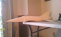 Name: IMAG0474.jpg
Views: 183
Size: 131.8 KB
Description: Got one side of my fuse cut, here it is mocked up with the tail and canopy.