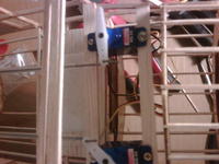Name: servo2.jpg
Views: 171
Size: 67.3 KB
Description: The mounted servos with heavy duty pushrods.  I expect the rudder to fall off long before the pushrods do!