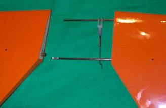 Components of the full-flying stabilizer.  The stabilizer rotates around the rear rod, while the servo moves the front rod.