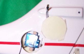 The servo in place with the hardwood blocks epoxied on either side of the servo (helping to hold the servo in position).