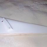 vertical fin closeout, already installed and slotted for hinges.  You'll also note the tail servo hole is pre-cut (circular area along the red line with the cover taped in place).