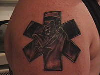 Name: IMGA0085.jpg
Views: 86
Size: 111.3 KB
Description: The wife's new tattoo,,,"Keepin the Reaper at bay",,,atleast until her shift is over.