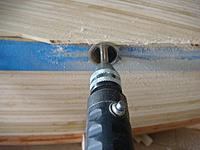 Name: DSC01498.jpg
Views: 143
Size: 73.4 KB
Description: Trimming the aft planks with a diamond cutting wheel with a spacer on the shaft center to keep the spacing I want.