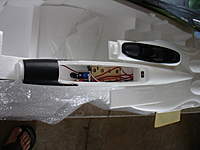 Name: DSC00916.jpg
Views: 150
Size: 48.4 KB
Description: Internal view. You can see the wood plate it comes with for the battery. You can also see the rudder servo that controls just the front wheel. I have removed it because I will be building plane with no wheels since I land on grass.