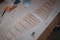 Name: KittyHawk 070.jpg
Views: 721
Size: 61.5 KB
Description: Lay them in, clip & fit the aileron ones, pin into place behind the spar & hit them with thin CA (BUT NOT FORWARD OF THE SPAR YET)