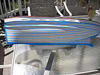 Name: Masking for Faux Planks.jpg
Views: 66
Size: 303.3 KB
Description: Blue masking tape is cut into strips and is applied to the hull.  This represents the caulking lines.