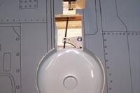 Name: Kyosho P40-50 series build mods 004.jpg
Views: 270
Size: 41.0 KB
Description: Here is the pushrod adjusted as it came. It was wrong and the Ez connector was making contact with the rib under the plastic wheel well. The plywood plate that the bell crank is on needs to be epoxied. Do not skip this step. IT WILL BREAK FREE!