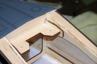 Name: Kyosho P40-50 series build mods 012.jpg
Views: 150
Size: 54.8 KB
Description: Wing T-nut plate. Grind out all hot glue, sand, add triangle stock accross the back and epoxy.