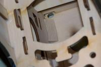 Name: Kyosho P40-50 series build mods 009.jpg
Views: 162
Size: 37.6 KB
Description: Factory installed triangle stock on firewall of motor box. This is also hot glued. Sand as much of the ply in this area as you can then apply epoxy.