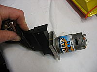 Name: MRPmod_5.jpg
Views: 75
Size: 57.2 KB
Description: Motor mounted.  1 Screw holds the back in place same as the original.  Front held together by the pull-pull steering bolts (not shown).