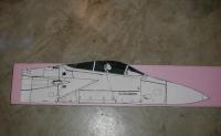 Name: foamie1.jpg
Views: 92
Size: 52.4 KB
Description: A full size copy of the nose section is attached to a 4" block of foam. It is cut out and sanded to shape.
