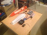 Name: BeeStuff.jpg
Views: 36
Size: 241.4 KB
Description: Here's some of the stuff yet to be installed. Upper deck is white and will hold the KK board, lipo pack, LED wiring, etc. Orange thing is optional lower pod with motor, lipo and FVP stuff. Sorry, the FVP equipment is still in transit.