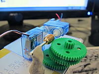 Name: IMG_3392.jpg
Views: 78
Size: 141.9 KB
Description: Part of the new system. The sideways servo can move in a 270 degree arc to mesh with any one of 5 gears on each side. The metal worm gear and 3 green gears are just place-holders for now.