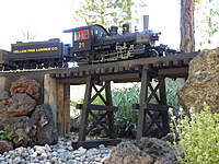 Name: RR AH bridge.jpg
Views: 137
Size: 89.6 KB
Description: a good running 'Connie' is still hauling coal from the mine...the old trestle still seems to be holding up!