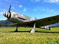 Name: fw190d9-3.jpg
Views: 59
Size: 196.9 KB
Description: Cowl got eaten by a rogue spinner a while back and has been rebuilt with a combo of  aluminum sheet fiberglass and epoxy/microballoons .Haven't gotten round to the repaint .Some of the guys say leave it , the more beaten up it gets the better it looks .