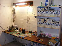 Name: picDSCF0061.jpg
Views: 219
Size: 115.3 KB
Description: Board assembly, soldering, fixing zone. Parts are kept in the boxes in the shelves, bulk lots are in boxes under the bench