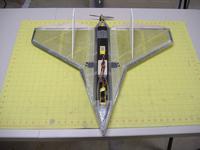 Name: DSCF2485.jpg Views: 559 Size: 73.9 KB Description: Apply cross weave strapping tape to nose section of plane. Then cut plastic canopy to fit and attach with cross weave strapping tape. Glue rear stabilizers in place per template.