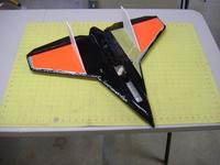Name: DSCF2505.jpg Views: 417 Size: 56.5 KB Description: The top of the plane is covered in day glow orange with black trim. The rear stabilizers are black and white to give more variation in color.