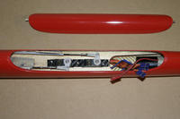 Name: A9.jpg
Views: 999
Size: 55.2 KB
Description: I used some balsa to space the pushrods out instead of cutting the servo tray to move the servos. Using the holes pictured yielded more than enough throw.
