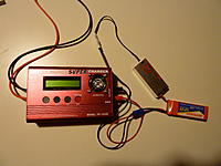 Name: P1010151.jpg
Views: 21
Size: 173.5 KB
Description: Thunder power 1010C charger. Silver box is balancer, which monitors cells, and balances voltage in each cell.