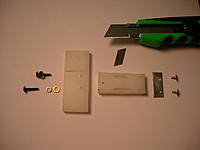 Name: DSCN8930.jpg
Views: 249
Size: 70.9 KB
Description: Basic parts, two pieces of nylon, four small screws and washers, a retainer plate for the blade and the blade.