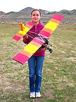 Name: Cox Ultralight 005.jpg
Views: 595
Size: 137.8 KB
Description: Evelyn holding the Cox Sky Rally Ultralight with brushless motor conversion