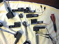Name: Electric Retract.jpg
Views: 762
Size: 106.5 KB
Description: RCLander at the top opened with a sample Trunnion and assemble retract below it. 
To the Left the Freewing Electric retract, one opened in the middle with Trunnion attached to strut.
Bottom right corner a ChangeSun Retract with RCLander Strut attached.