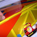 Applying Scotch MultiTask tape to wing side of hinge gap