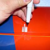 Marking the covering for servo horn holes