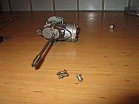 Name: IMG_2032.jpg
Views: 20
Size: 123.9 KB
Description: From a different angle....
Very clearly visible that this lttle engine is a custom design for this outboard. Virtually no parts fit in any other engine. The engine block has an integrated gear-box (with slightly increasing ratio of 15:13).
Note the cool