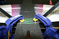 Name: IMG_6717.jpg
Views: 134
Size: 206.6 KB
Description: Here I have clamped the landing gear assembly down to the fuselage to create a good glue joint between the fuselage and plate.  The gear are inserted only to hold the plate down.  I will remove the gear for further assembly  when the plate is dry.  Take c