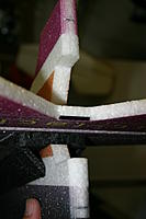 Name: IMG_6787.jpg
Views: 95
Size: 70.8 KB
Description: Using the hinges in the rudder as a guide, mark for the hinge slots in the fuselage.  Warning:  I put my top hinge in too high and had to change it.  Install top hinge no higher than the purple line in the scheme.