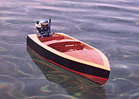 Name: ArrowFront.jpg
Views: 179
Size: 75.0 KB
Description: The Arrow - 1950s design from an old softcover boat building book.  Motor is a 1957 Evinrude 35hp electric by K&O Models.  I made some modifications to the original plan, including lengthening the proportions a bit to make it a bit sleeker looking.  B