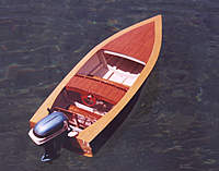 Name: ArrowRear.jpg
Views: 179
Size: 75.5 KB
Description: The Arrow - 1950s design from an old softcover boat building book.  Motor is a 1957 Evinrude 35hp electric by K&O Models.  View shows the steering wheel - modeled after the old Kainer style wheels available in the '50s.